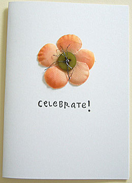 celebrate this day. a happy birthday card handmade with button and silk flower.